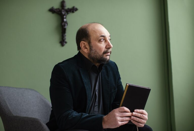 religious-man-holding-holy-book